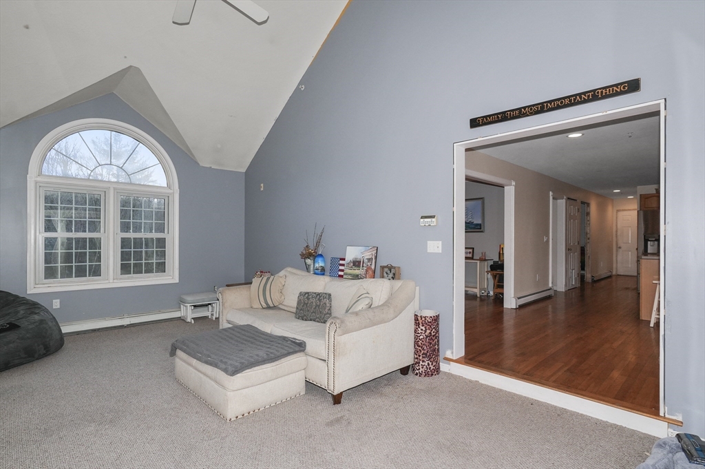 24 North End Road Townsend, MA 01469 - Photo 5 of 35 a spacious bedroom with a bed and a large window