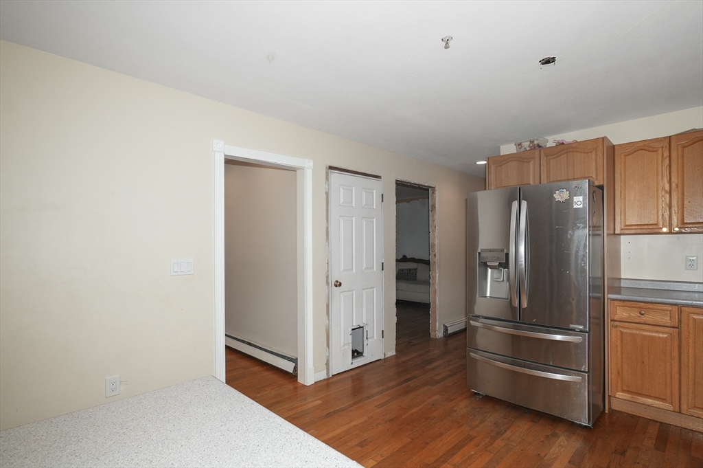24 North End Road Townsend, MA 01469 - Photo 8 of 35 a view of kitchen with wooden floor and electronic appliances