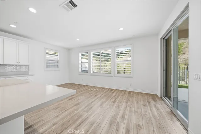 an empty room with a empty space and window