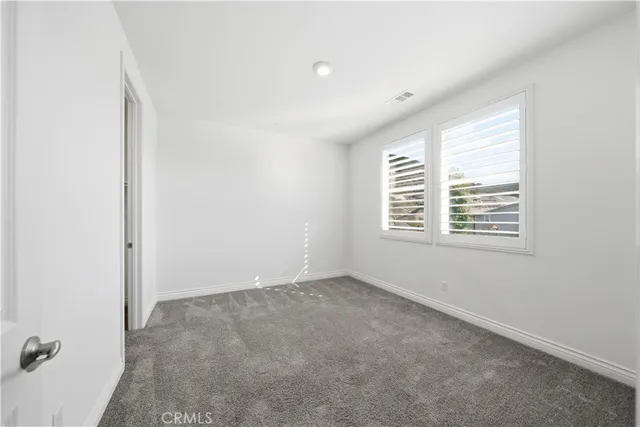 an aerial view of a house with a swimming pool
