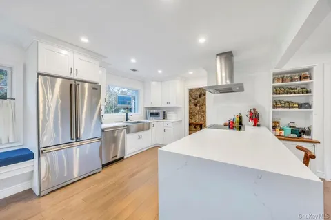 a white refrigerator freezer sitting inside of a kitchen