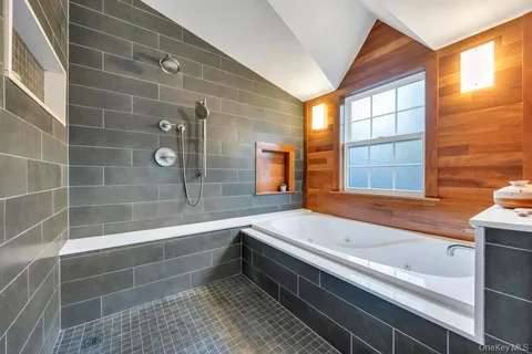 a bathroom with a bathtub and a sink