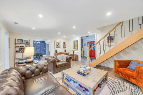 a living room with furniture and a rug