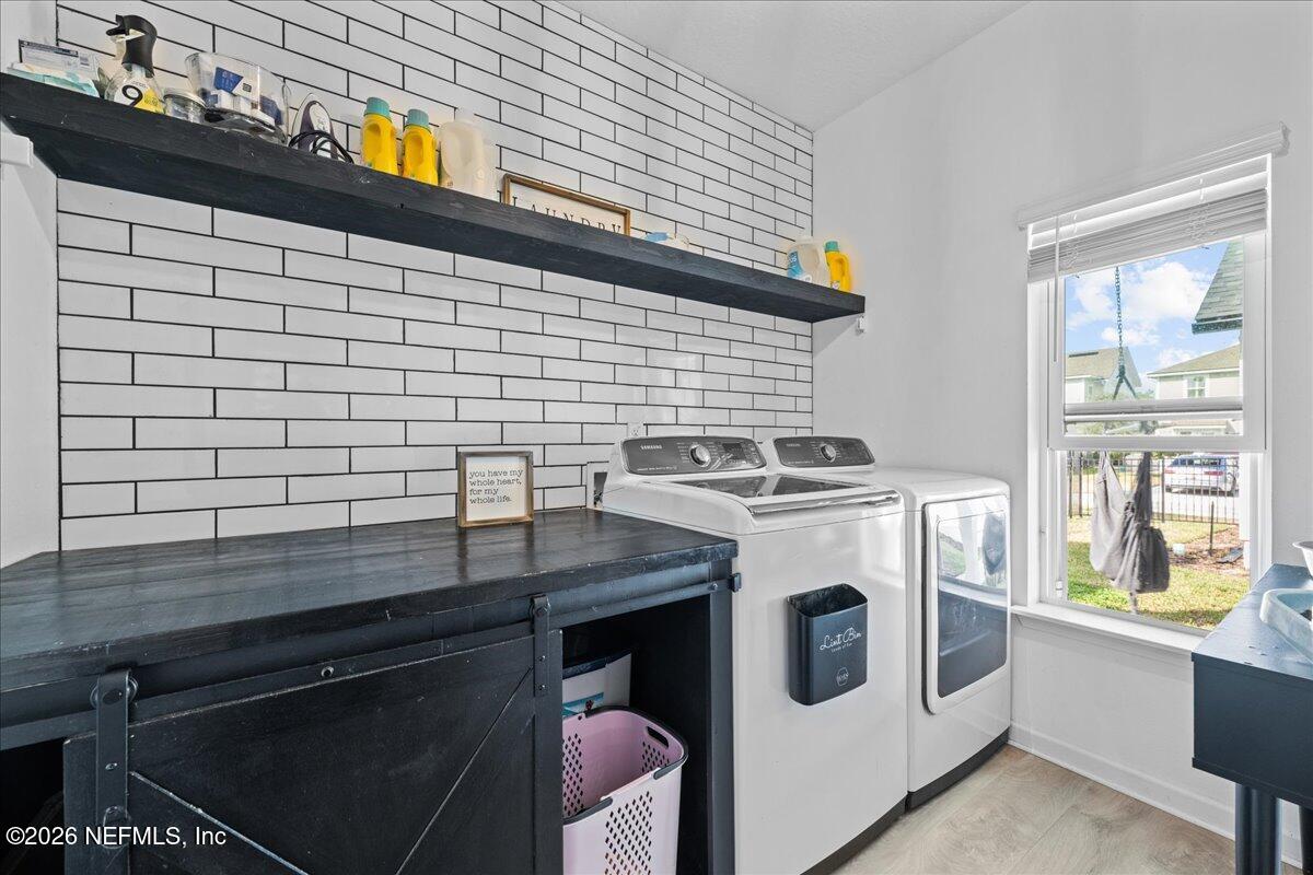92 Patina Place St. Augustine, FL 32092 - Photo 15 of 26 a utility room with dryer and washer