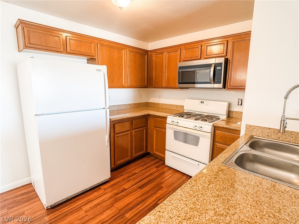 7701 West Robindale Road, Unit 110 Las Vegas, NV 89113 - Photo 6 of 21 A well-appointed kitchen features ample cabinetry, durable countertops, and essential appliances.