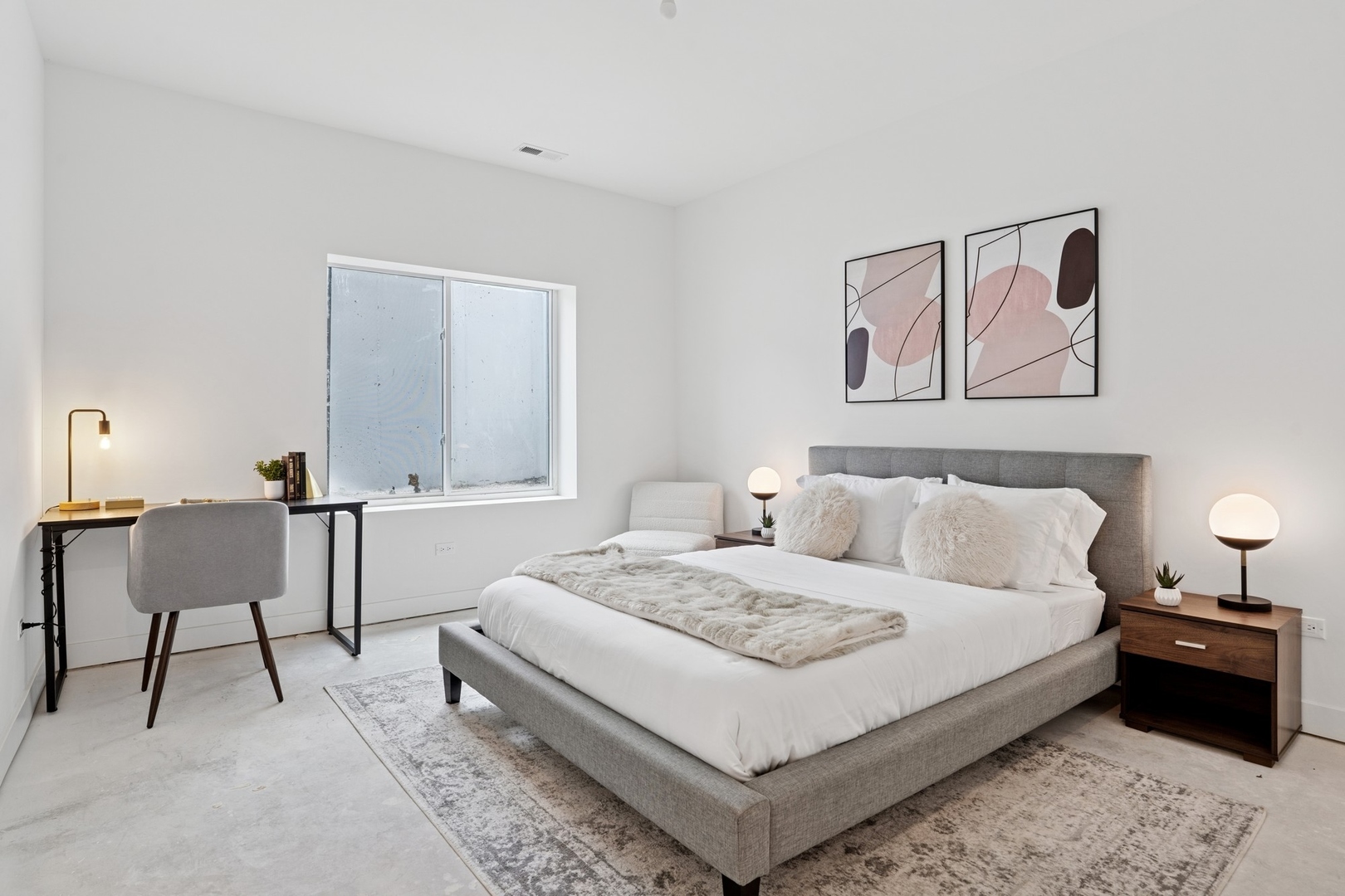 6755 North Hermitage Avenue, Unit 1 Chicago, IL 60626 - Photo 14 of 16 a large white bed in a white room