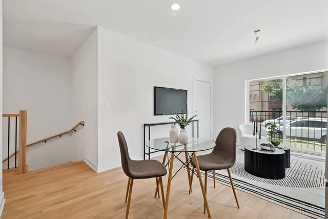a view of a livingroom with furniture and a flat screen tv