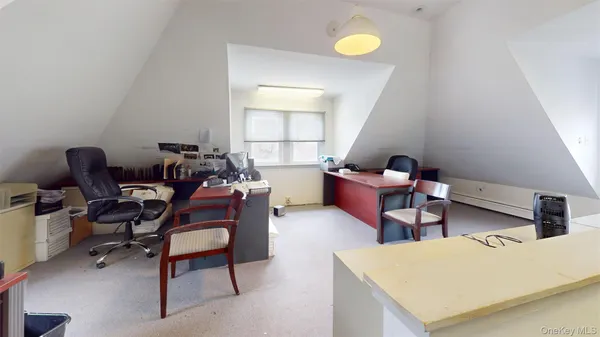 a view of room with window and wooden floor