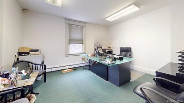 a view of a workspace with furniture