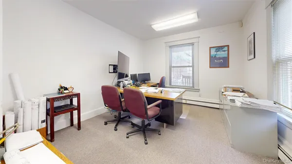 a kitchen with kitchen island sink stove and cabinets