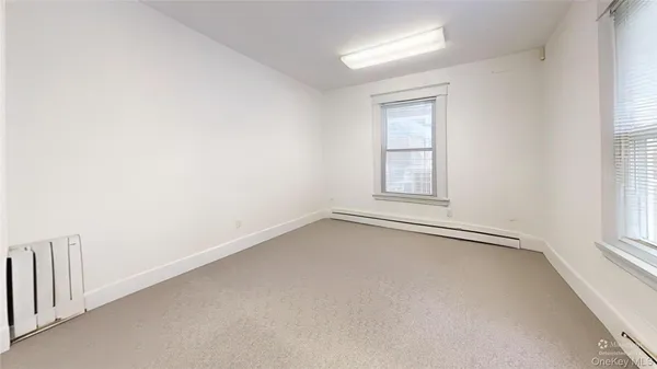 a view of entryway and kitchen