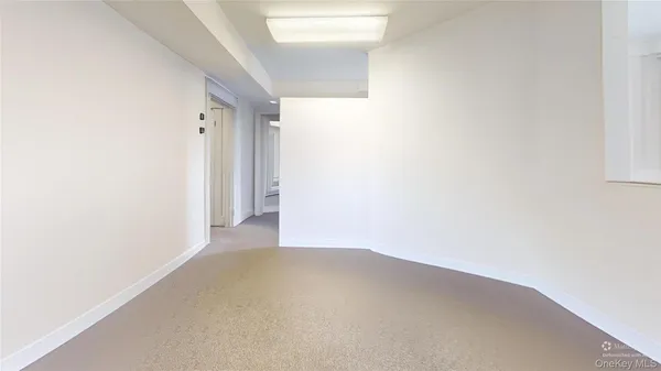 a room with furniture and flat screen tv