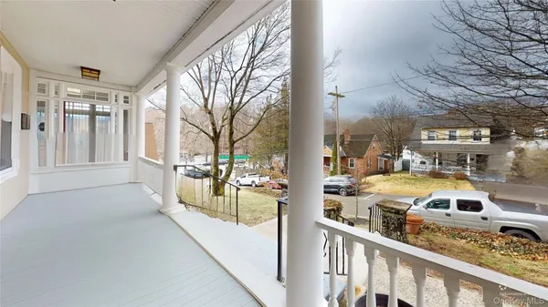 a view of a pathway with a house in front of it