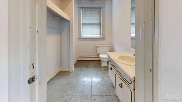 a white building with black and white floor