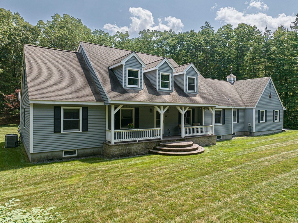 47 Southboro Road Upton, MA 01568 - Photo 1 of 42 a front view of a house with a yard