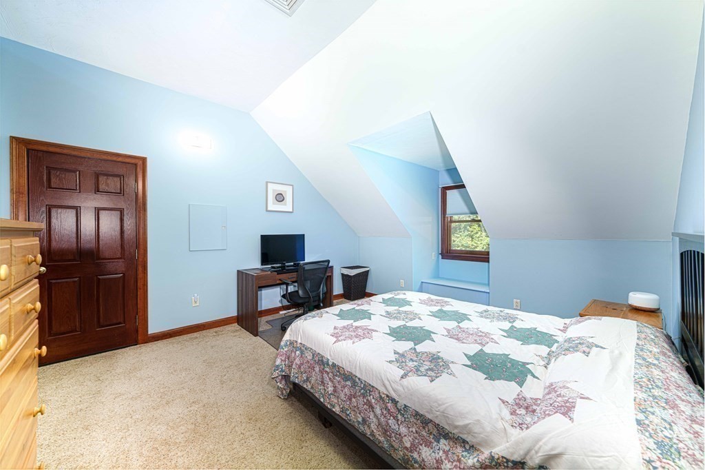47 Southboro Road Upton, MA 01568 - Photo 18 of 42 a bedroom with a bed and a refrigerator