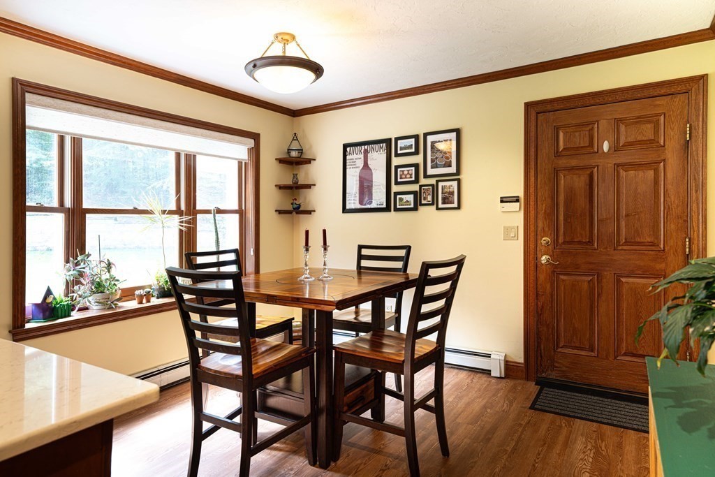 47 Southboro Road Upton, MA 01568 - Photo 8 of 42 a view of a dining room with furniture window and wooden floor