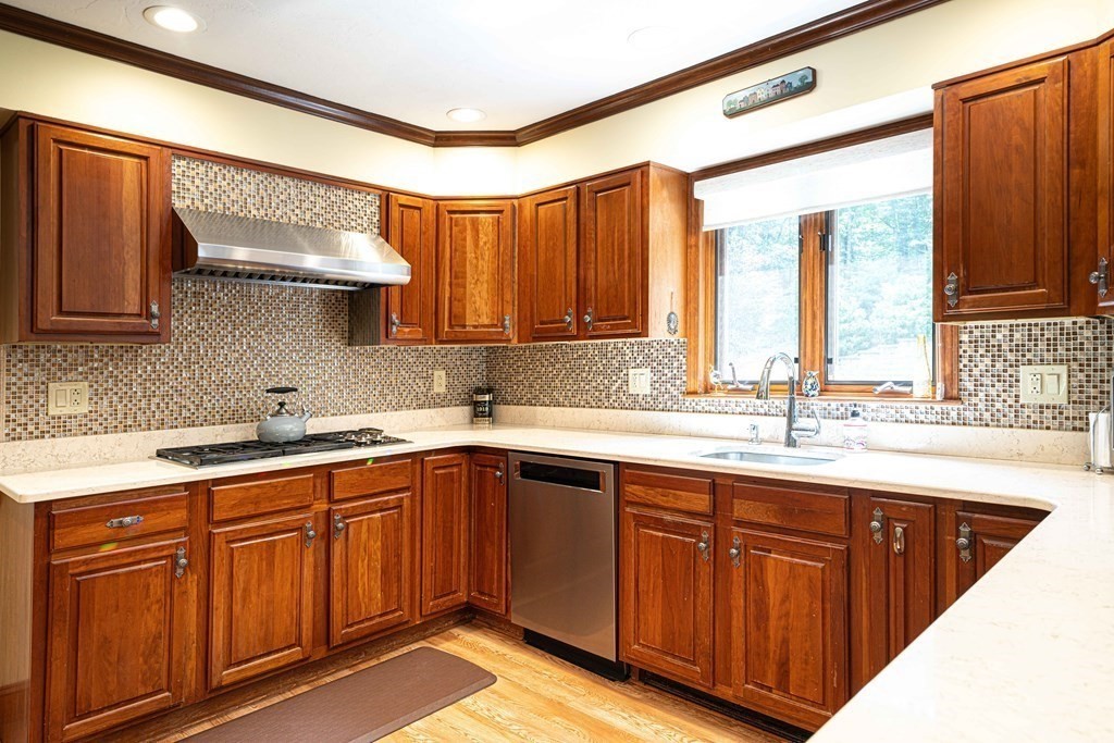 47 Southboro Road Upton, MA 01568 - Photo 9 of 42 a kitchen with a sink stove and cabinets