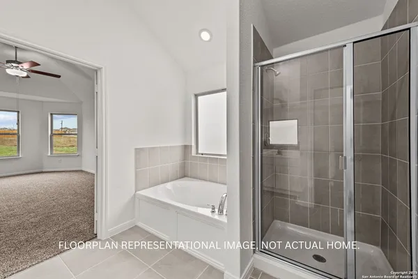 a bathroom with a shower and a bath tub