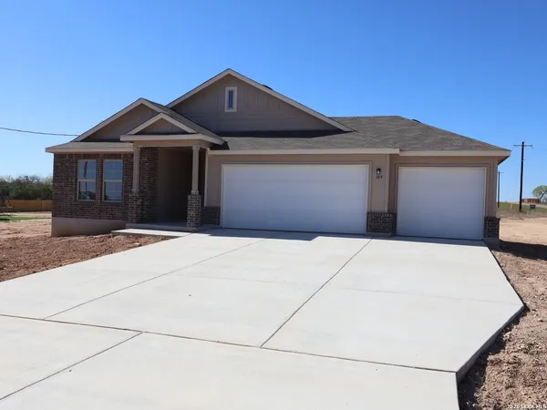 a front view of a house with a garage