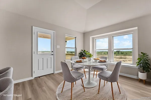 a view of a dining room with furniture window and outside view