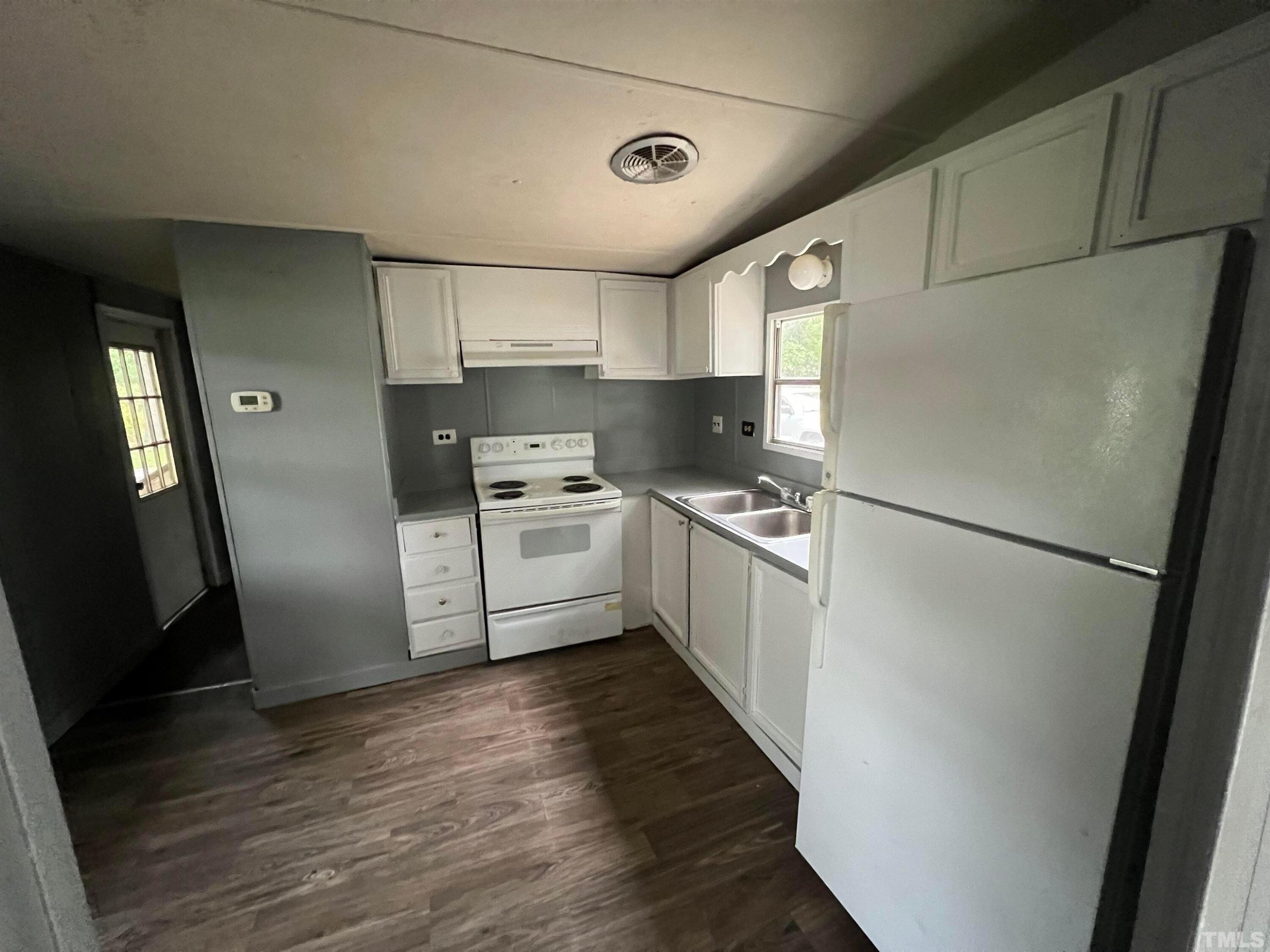38 Pine Forest Loop Louisburg, NC 27549 - Photo 1 of 9 a kitchen with stainless steel appliances a refrigerator a sink a stove a refrigerator and cabinets