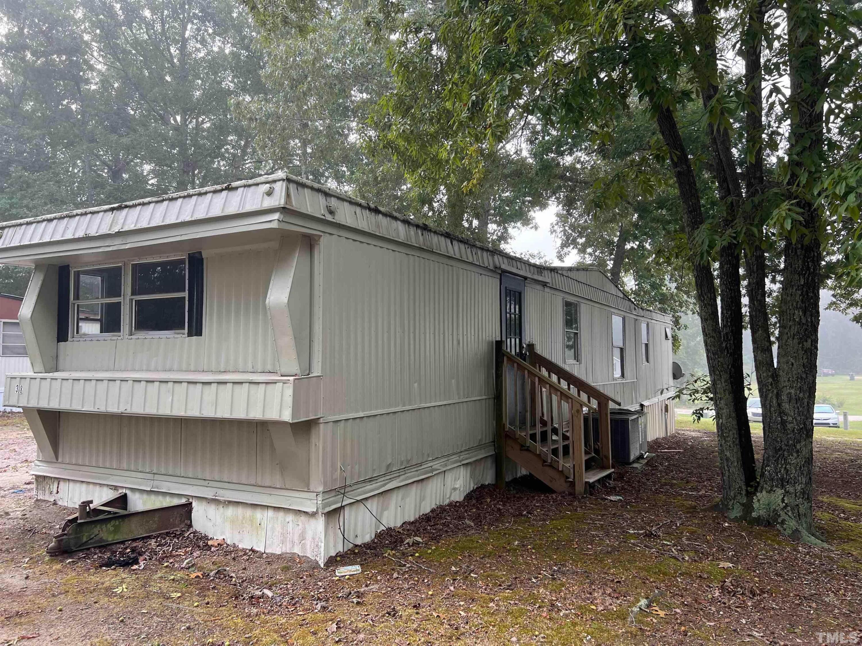 38 Pine Forest Loop Louisburg, NC 27549 - Photo 8 of 9 a house with a outdoor space