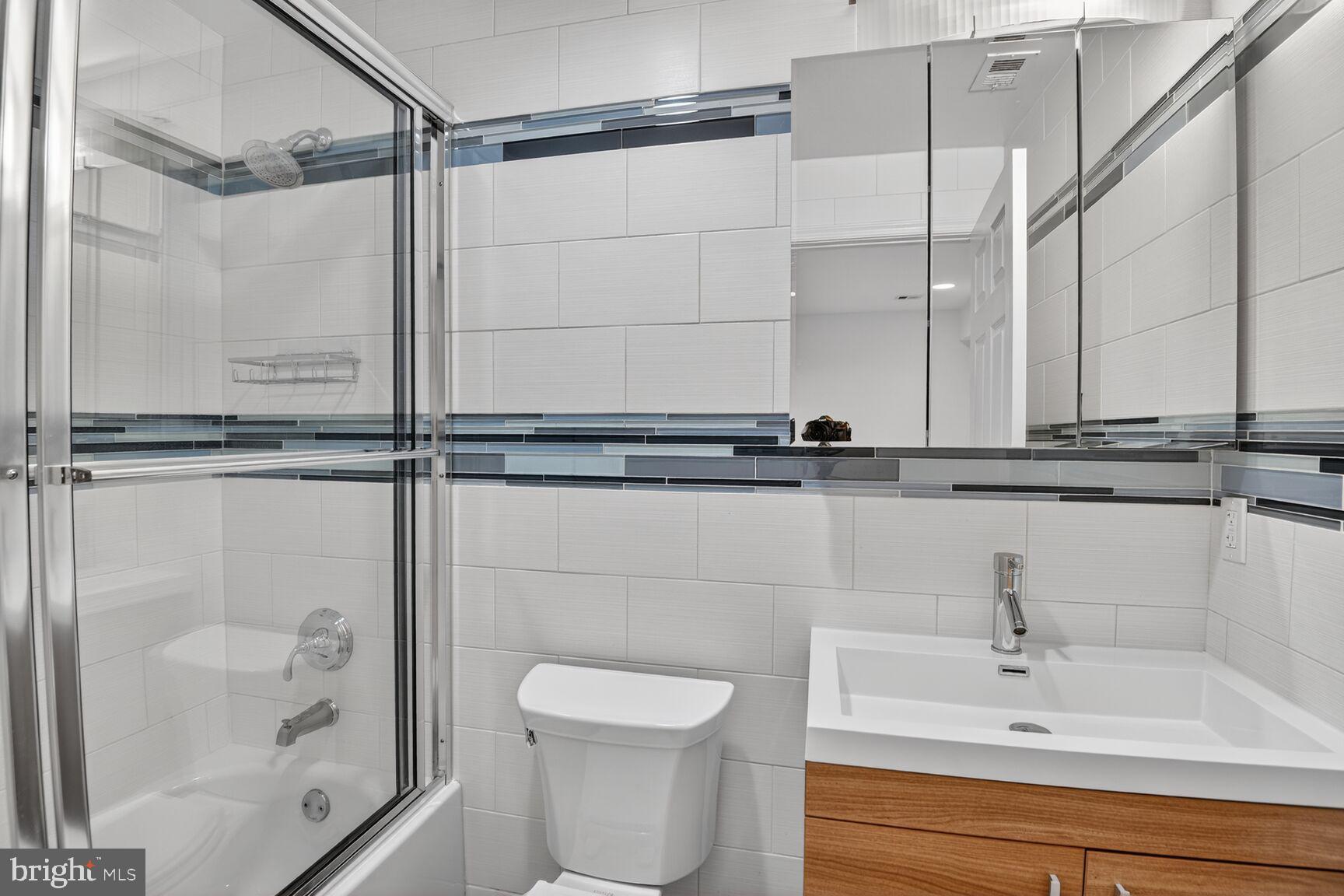 424 Q Street Northwest, Unit A Washington, DC 20001 - Photo 15 of 15 a bathroom with a shower and a sink