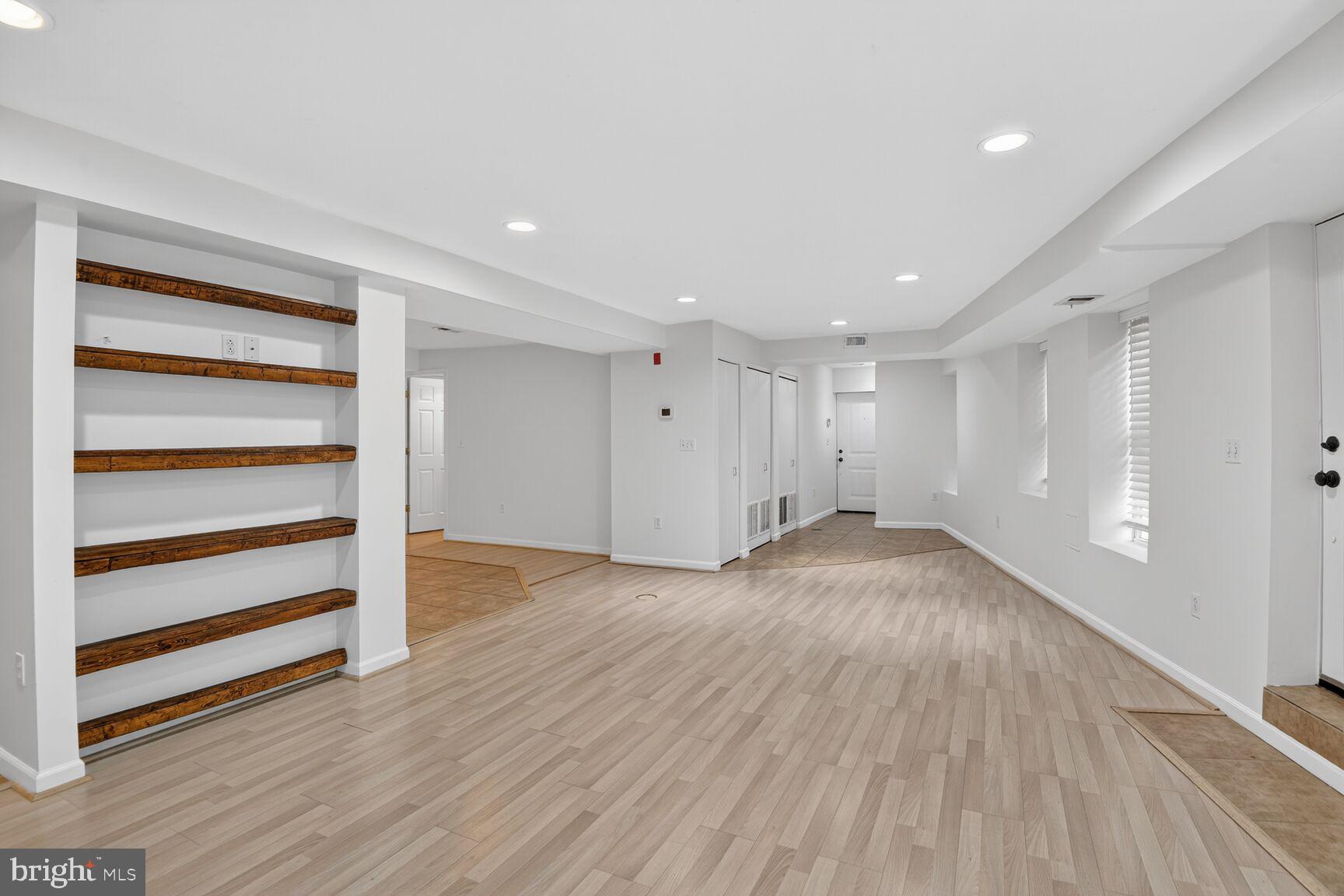 424 Q Street Northwest, Unit A Washington, DC 20001 - Photo 4 of 15 a view of empty room with wooden floor and window