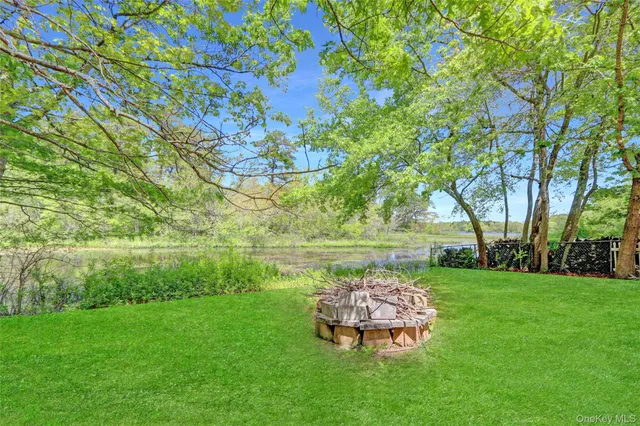 a garden view with a lake