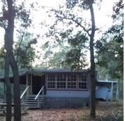 306 Roberts Road DeFuniak Springs, FL 32433 - Photo 3 of 13 a front view of a house with a yard