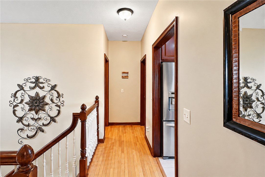 710 Governors Road Troy, OH 45373 - Photo 16 of 56 This interior hallway features hardwood flooring and a stylish staircase.