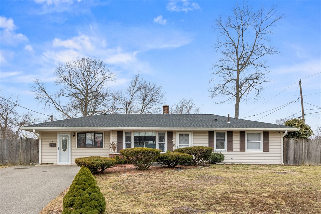 12 Dodge Road Brockton, MA 02302 - Photo 1 of 18 a front view of a house with a yard and potted plants