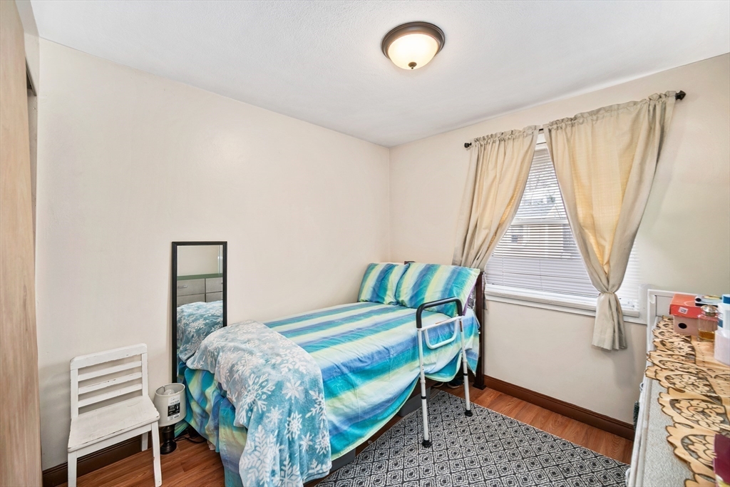 12 Dodge Road Brockton, MA 02302 - Photo 13 of 18 a bedroom with a bed and a window