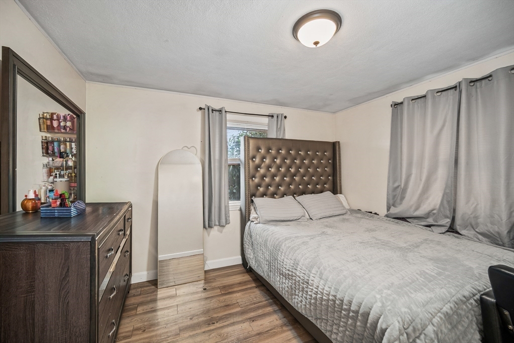 12 Dodge Road Brockton, MA 02302 - Photo 14 of 18 a bedroom with a bed and a table