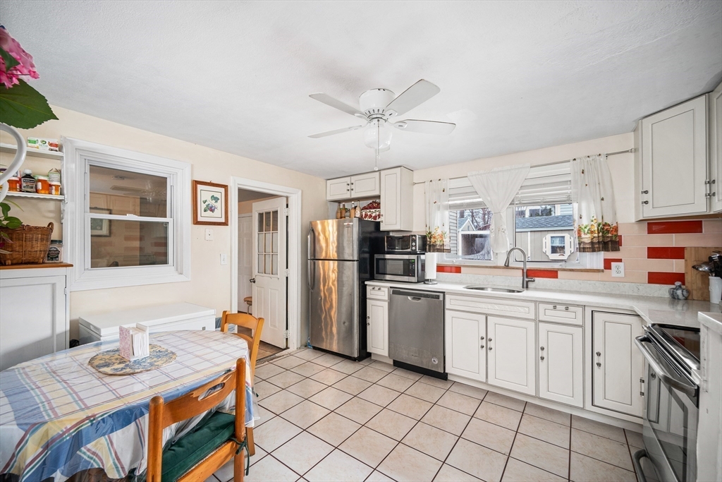 12 Dodge Road Brockton, MA 02302 - Photo 4 of 18 a kitchen that has a lot of cabinets in it and appliances