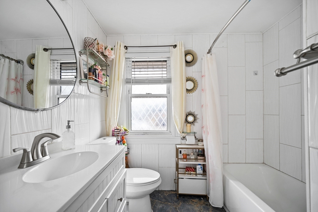 12 Dodge Road Brockton, MA 02302 - Photo 7 of 18 a bathroom with a sink a toilet and a bathtub