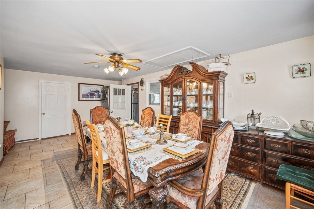 12 Dodge Road Brockton, MA 02302 - Photo 8 of 18 a view of a dining room with furniture and a chandelier