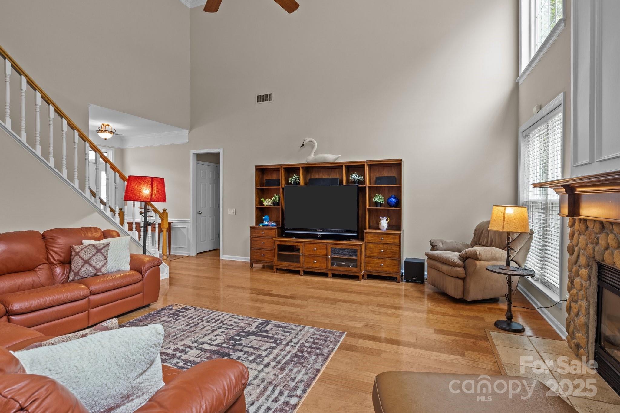 7710 Epping Forest Drive Huntersville, NC 28078 - Photo 16 of 37 a living room with furniture and a flat screen tv