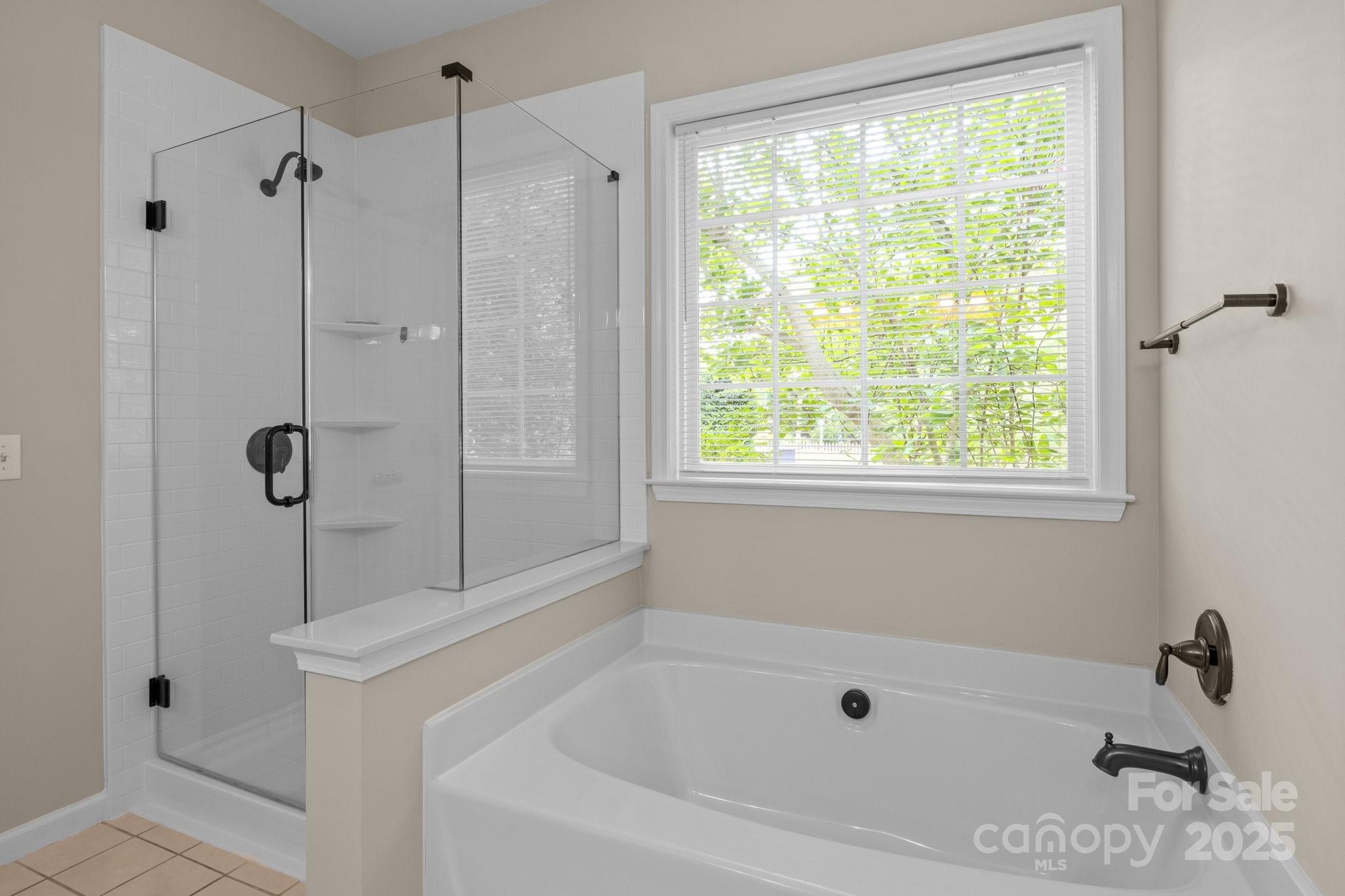 7710 Epping Forest Drive Huntersville, NC 28078 - Photo 19 of 37 a white bath tub sitting next to a window