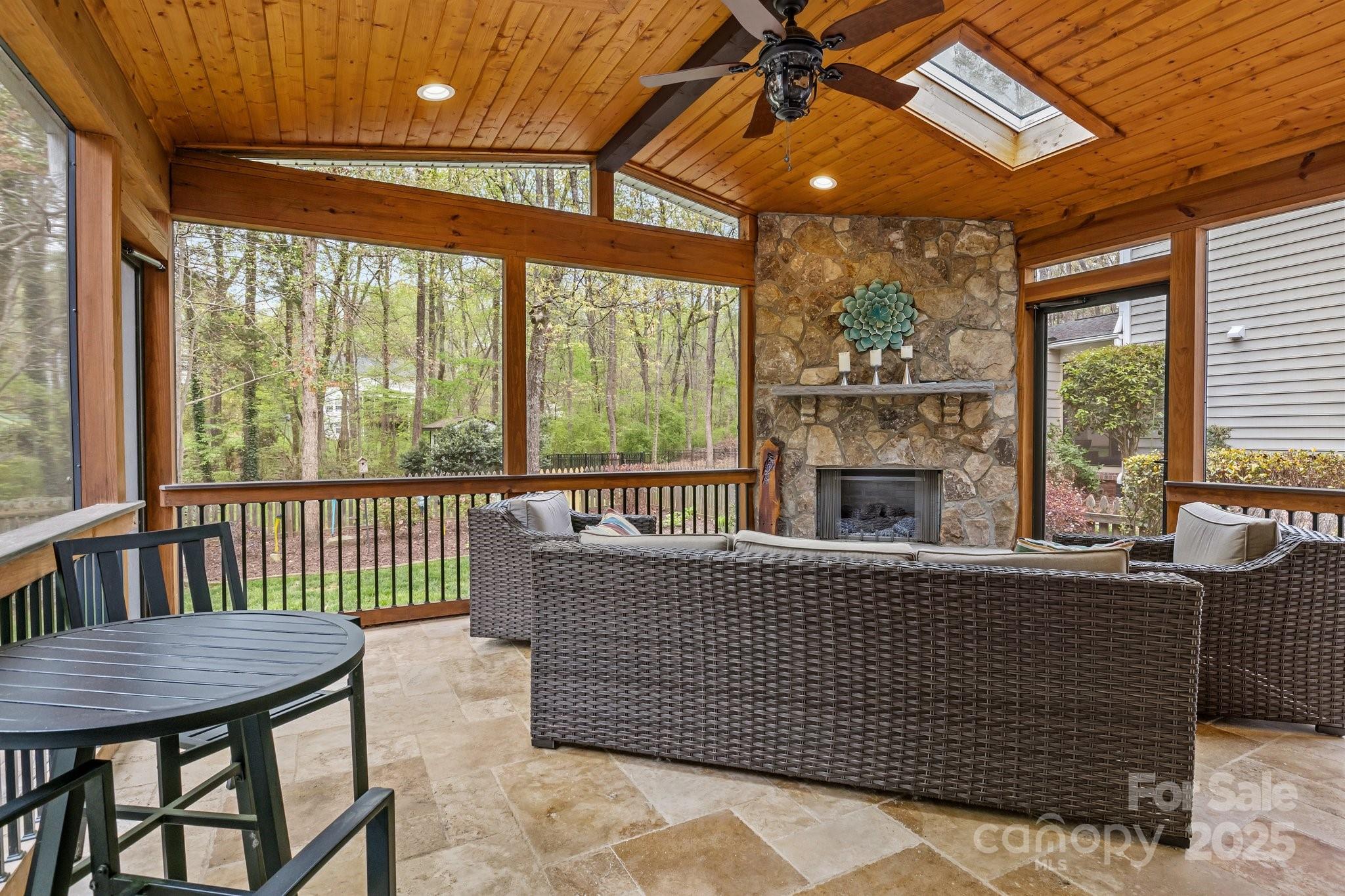 7710 Epping Forest Drive Huntersville, NC 28078 - Photo 2 of 37 a view of a dining room with furniture large windows and wooden floor