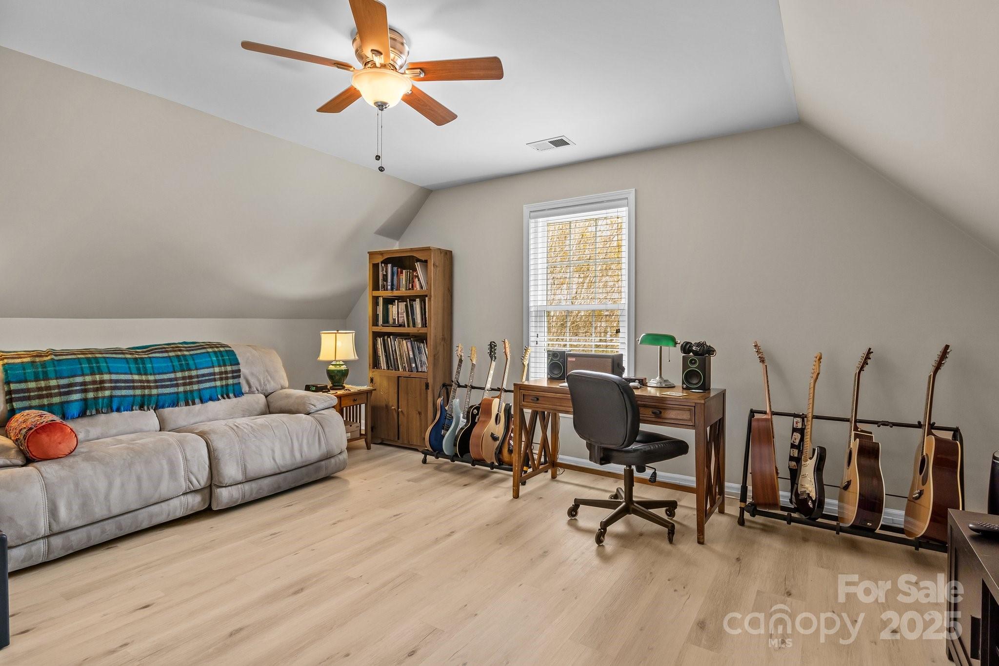 7710 Epping Forest Drive Huntersville, NC 28078 - Photo 21 of 37 a living room with furniture and a large window