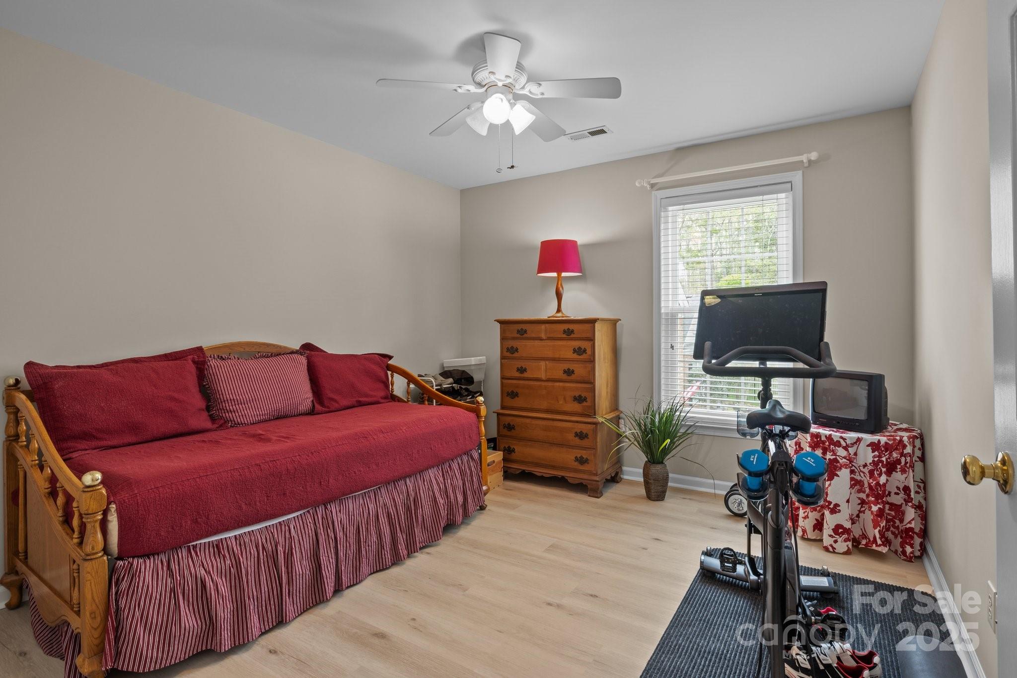 7710 Epping Forest Drive Huntersville, NC 28078 - Photo 23 of 37 a living room with furniture a flat screen tv and a chandelier
