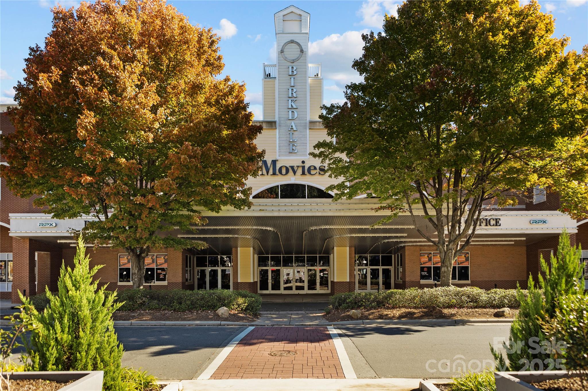 7710 Epping Forest Drive Huntersville, NC 28078 - Photo 37 of 37 a front view of a building with large trees and plants