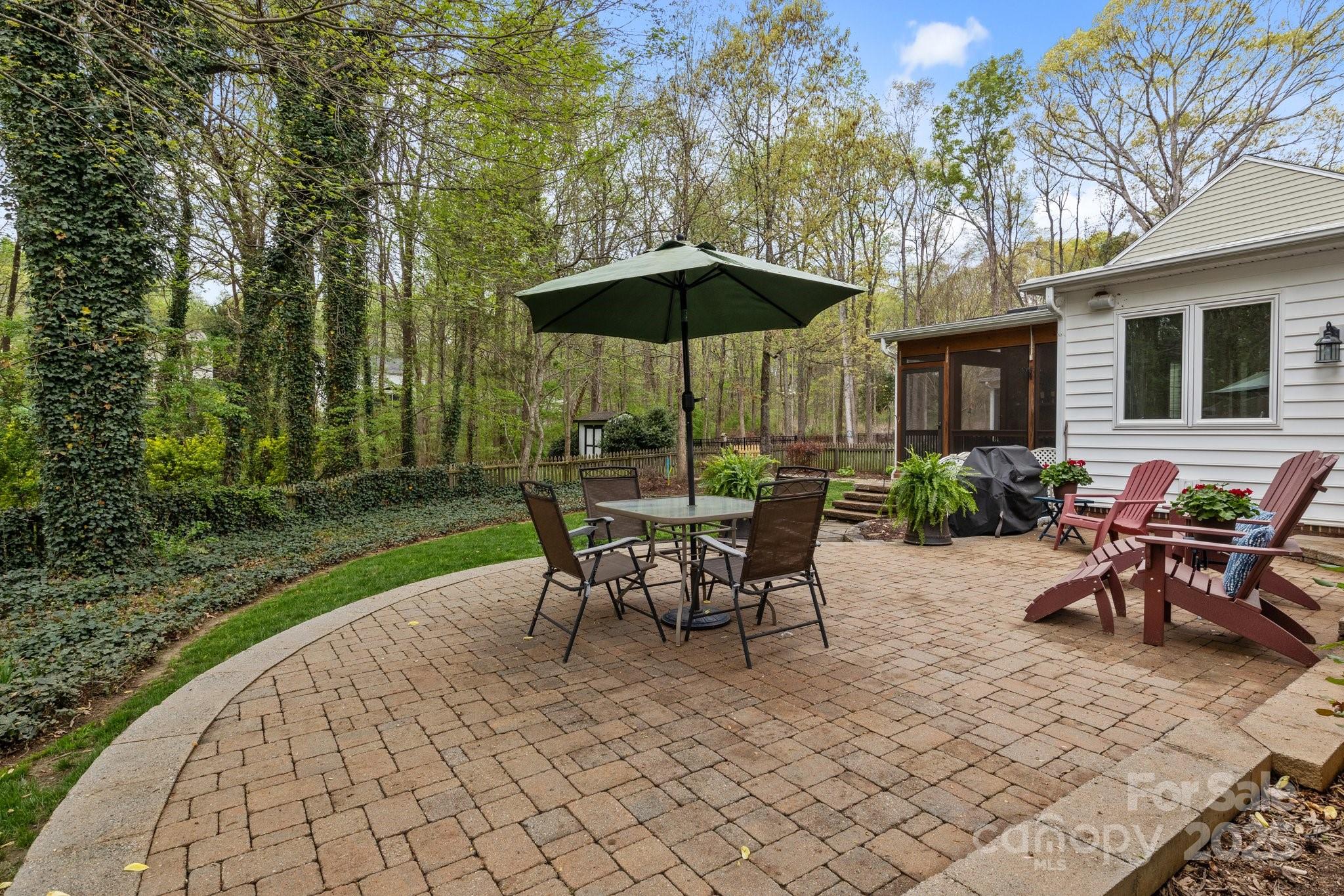 7710 Epping Forest Drive Huntersville, NC 28078 - Photo 4 of 37 a view of a outdoor space with a patio table and chairs