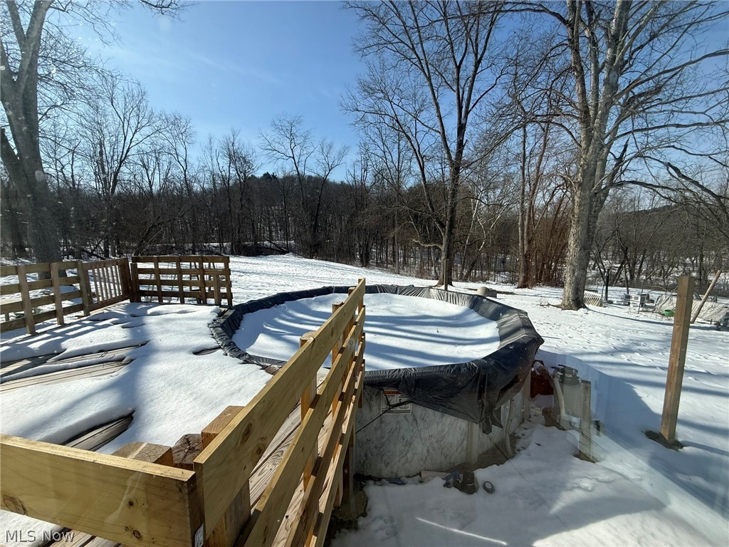 6784 Old Zoarville Road Northeast Dover, OH 44622 - Photo 36 of 50 Yard covered in snow with a deck