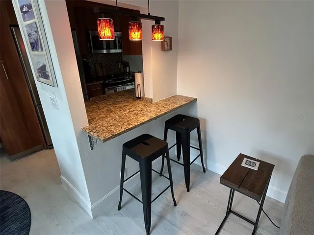 a view of a dining room with furniture and window