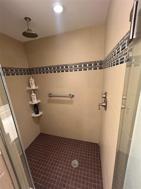 111 Pass Key Road, Unit 111 Sarasota, FL 34242 - Photo 17 of 23 a bathroom with a shower