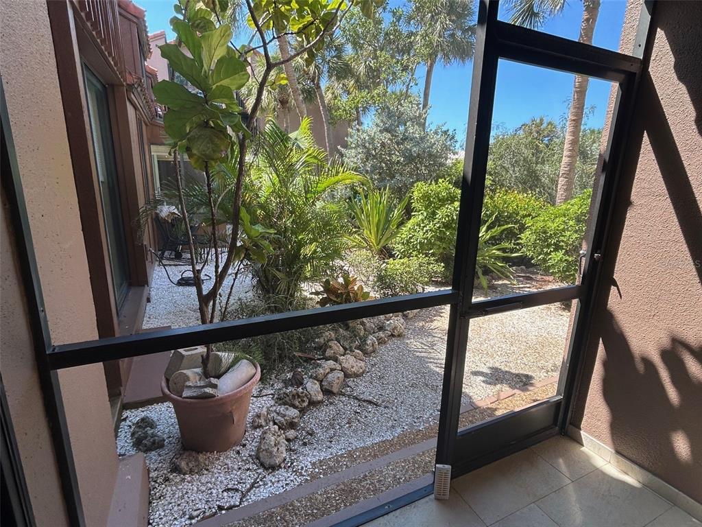 111 Pass Key Road, Unit 111 Sarasota, FL 34242 - Photo 19 of 23 a view of a porch with furniture