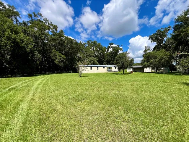 a view of a playground with basketball court